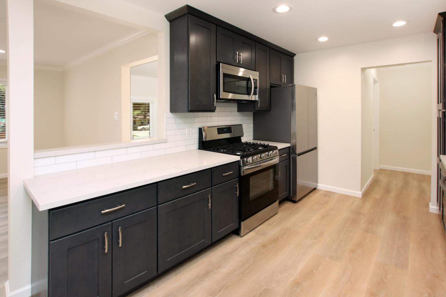 9260 Glen Arbor Road Ben Lomond, CA 95005 - Photo 7 of 33 a kitchen with stainless steel appliances a sink dishwasher a stove and a refrigerator