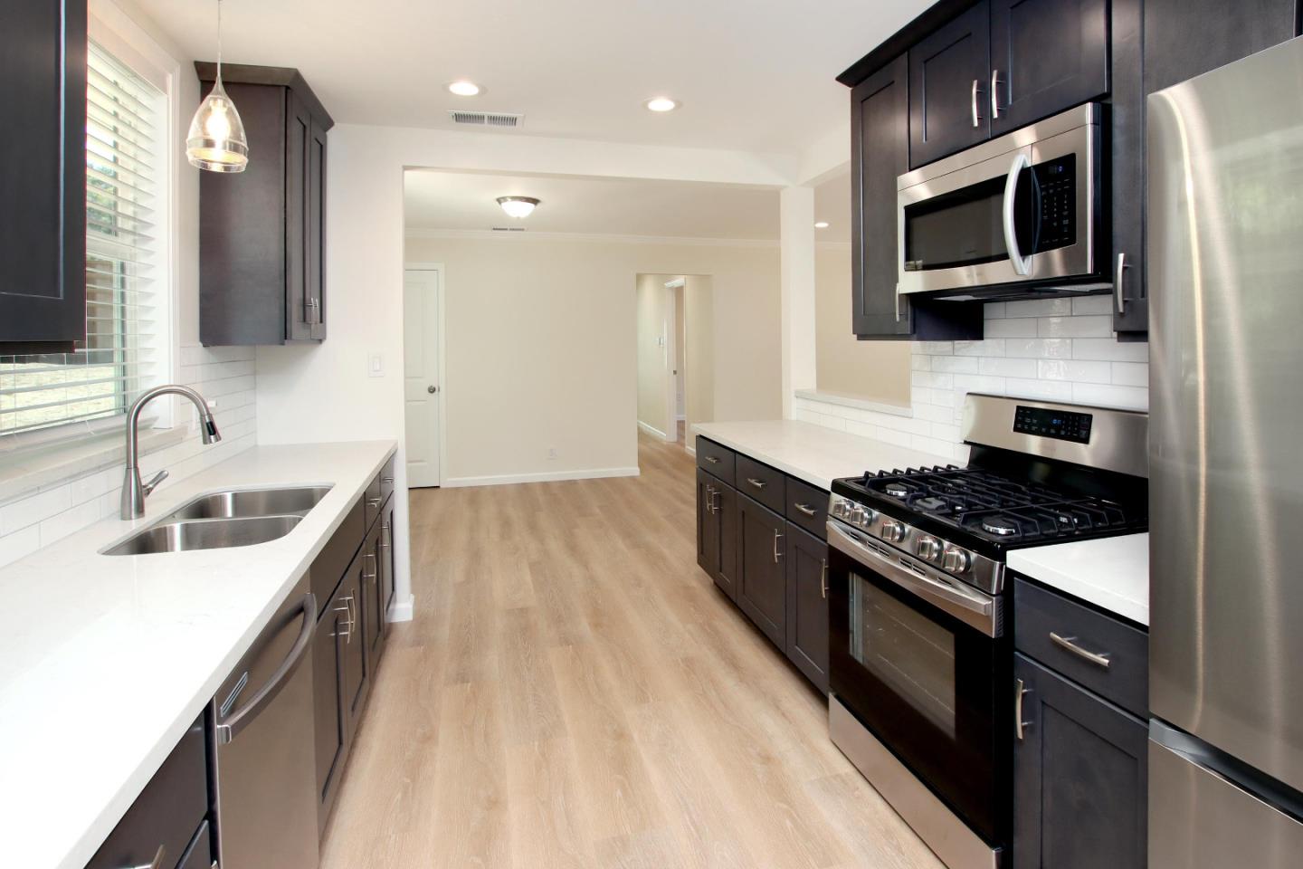 9260 Glen Arbor Road Ben Lomond, CA 95005 - Photo 8 of 33 a kitchen with stainless steel appliances granite countertop a sink and a stove top oven