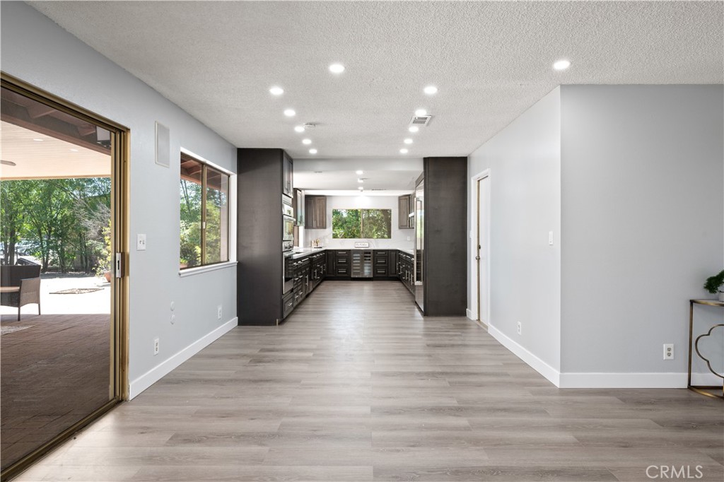 18561 Bert Road Riverside, CA 92508 - Photo 15 of 72 a view of an empty room with wooden floor and a window