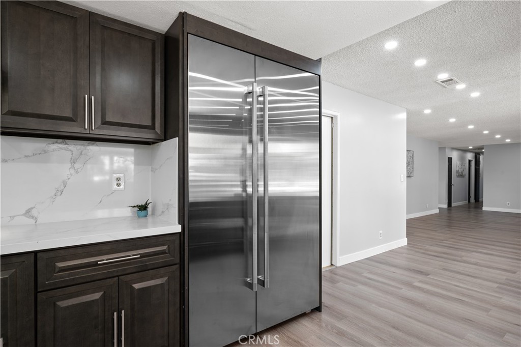 18561 Bert Road Riverside, CA 92508 - Photo 23 of 72 a kitchen with a refrigerator and a sink