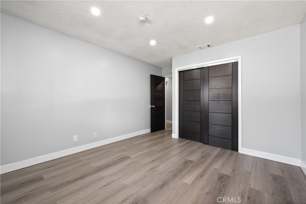 18561 Bert Road Riverside, CA 92508 - Photo 27 of 72 a view of an empty room with wooden floor