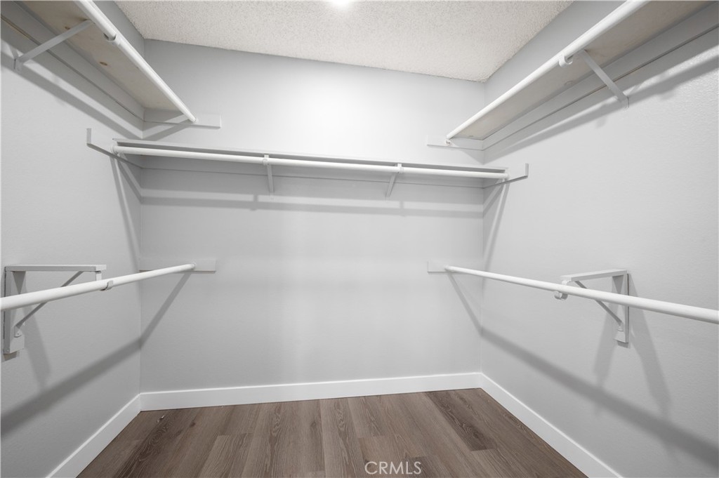 18561 Bert Road Riverside, CA 92508 - Photo 36 of 72 a view of walk in closet with empty racks