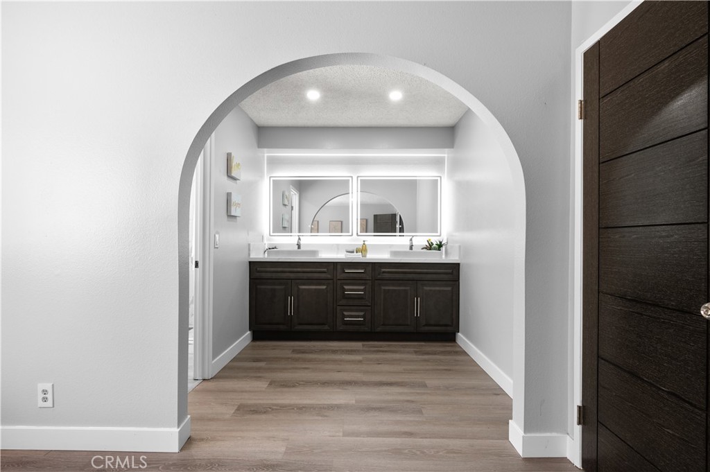 18561 Bert Road Riverside, CA 92508 - Photo 37 of 72 a bathroom with a sink vanity and a mirror