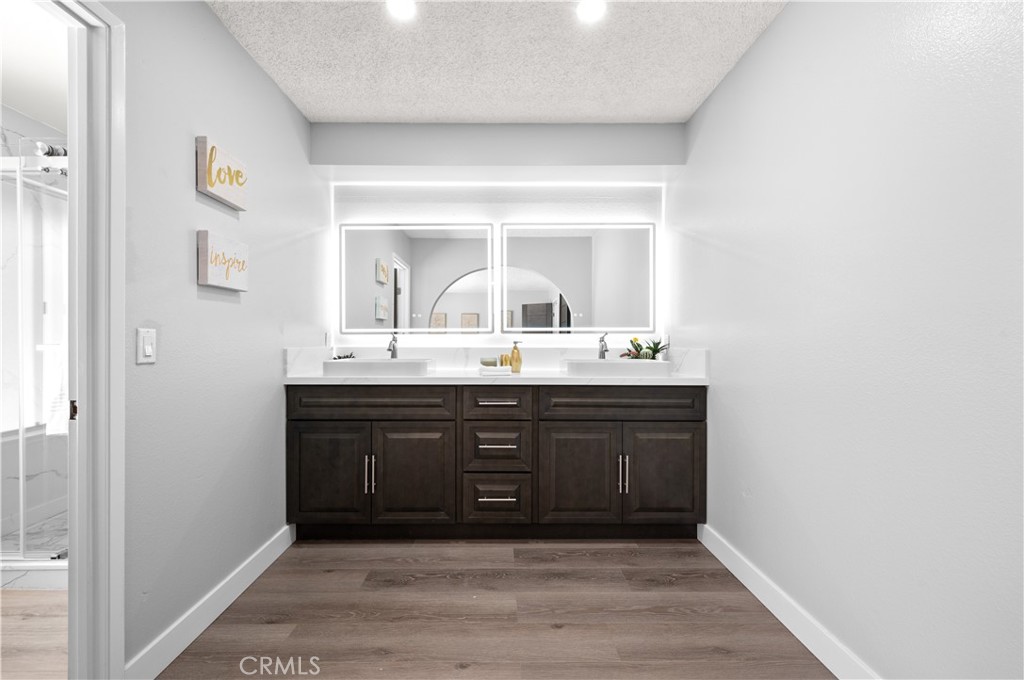 18561 Bert Road Riverside, CA 92508 - Photo 38 of 72 a bathroom with a sink vanity and mirror