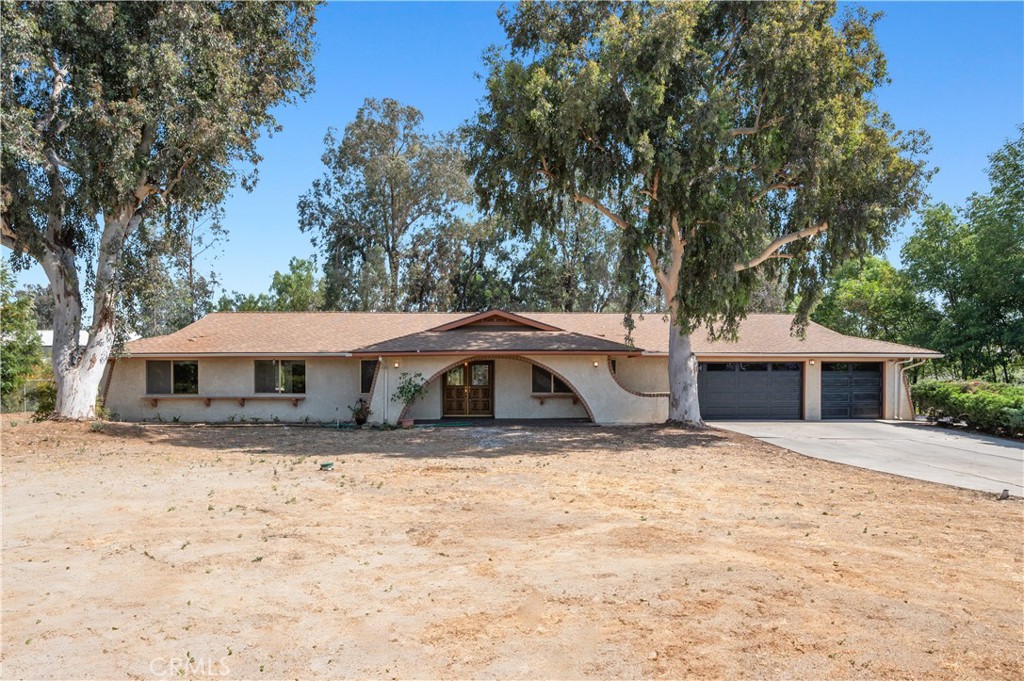 18561 Bert Road Riverside, CA 92508 - Photo 4 of 72 a view of a house with a snow in the yard