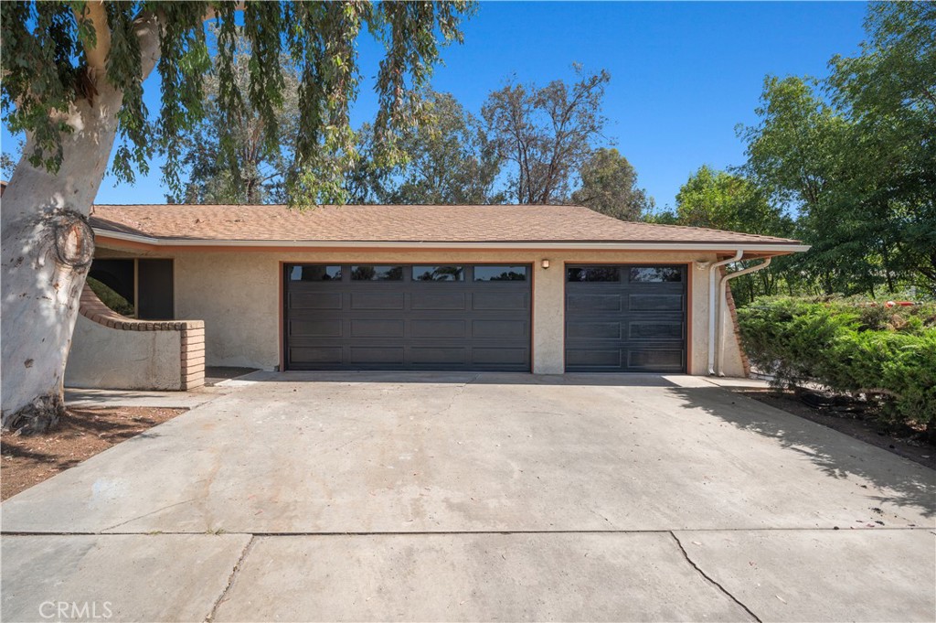 18561 Bert Road Riverside, CA 92508 - Photo 44 of 72 a front view of a house with a garage