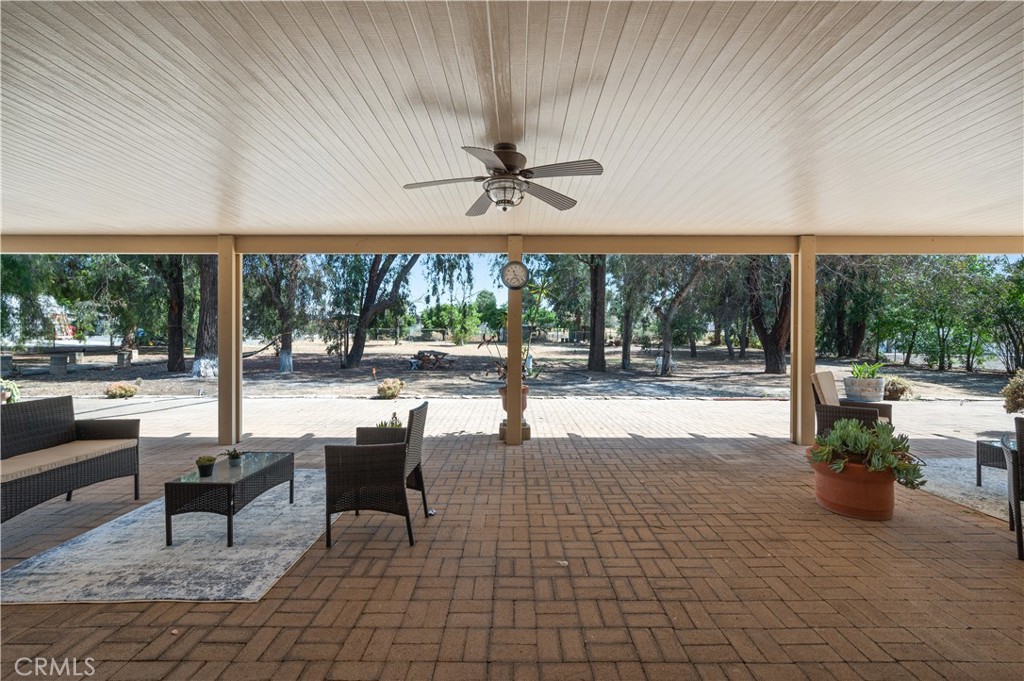 18561 Bert Road Riverside, CA 92508 - Photo 45 of 72 a view of a patio with a dining table and chairs