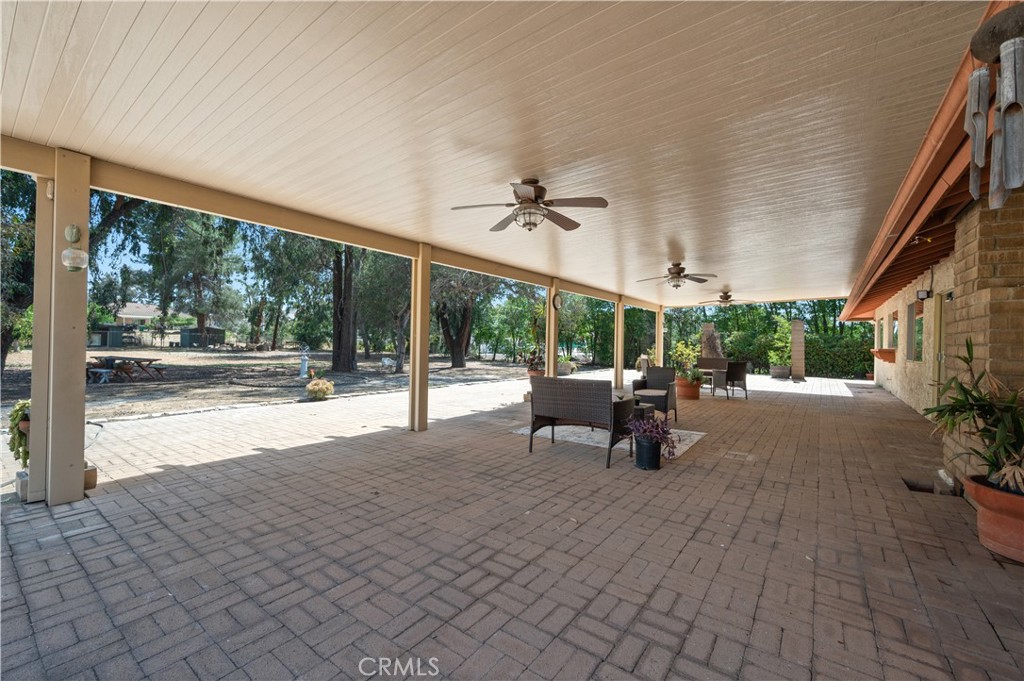 18561 Bert Road Riverside, CA 92508 - Photo 48 of 72 a view of a patio with a table and chairs