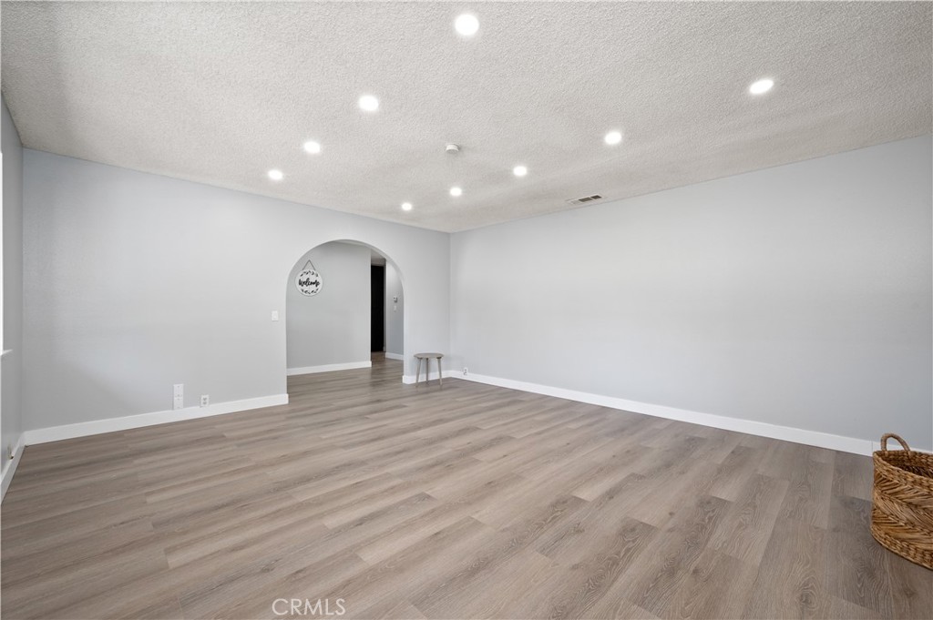 18561 Bert Road Riverside, CA 92508 - Photo 10 of 72 a view of empty room with wooden floor and fan
