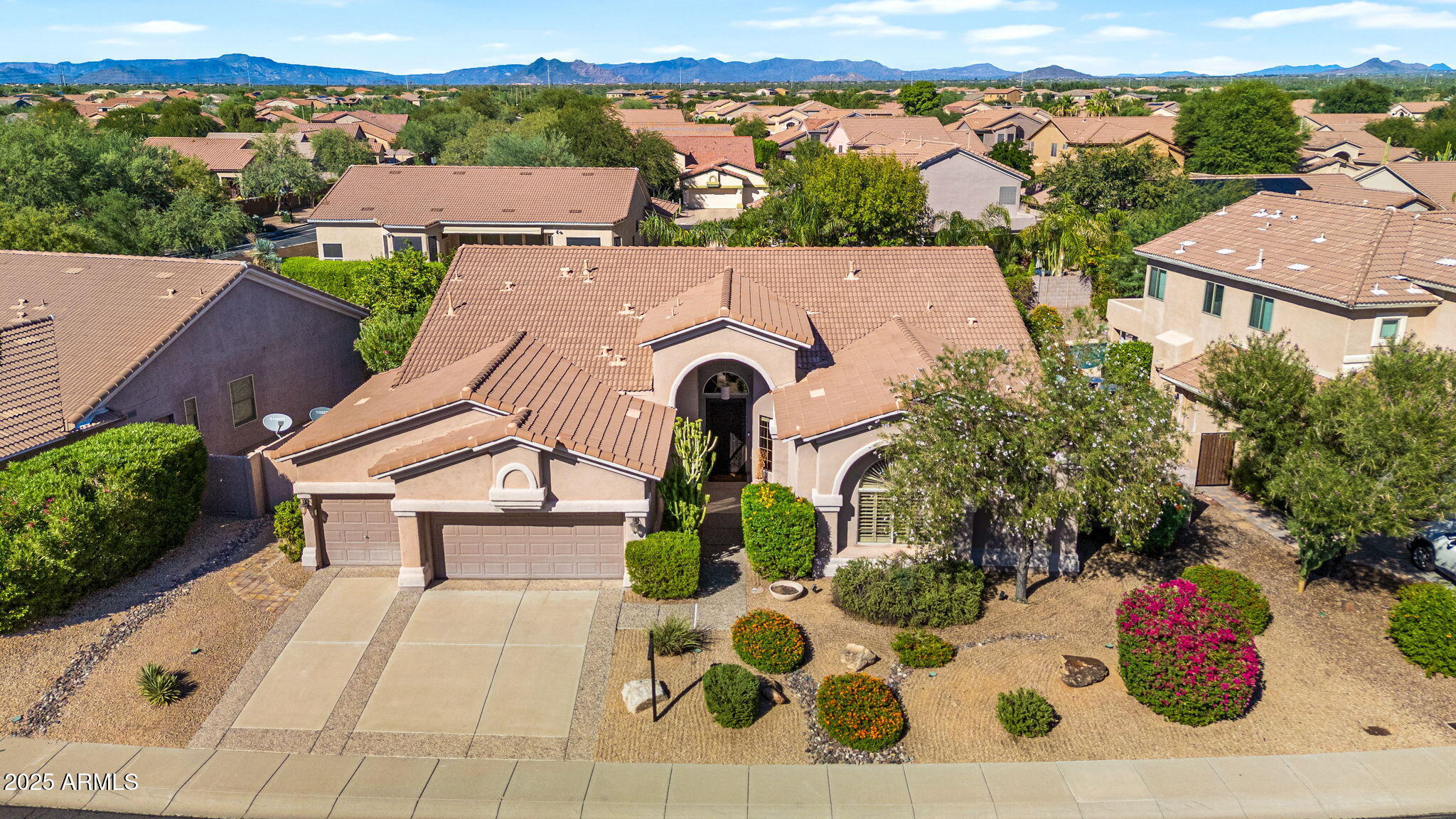 an aerial view of a house with yard