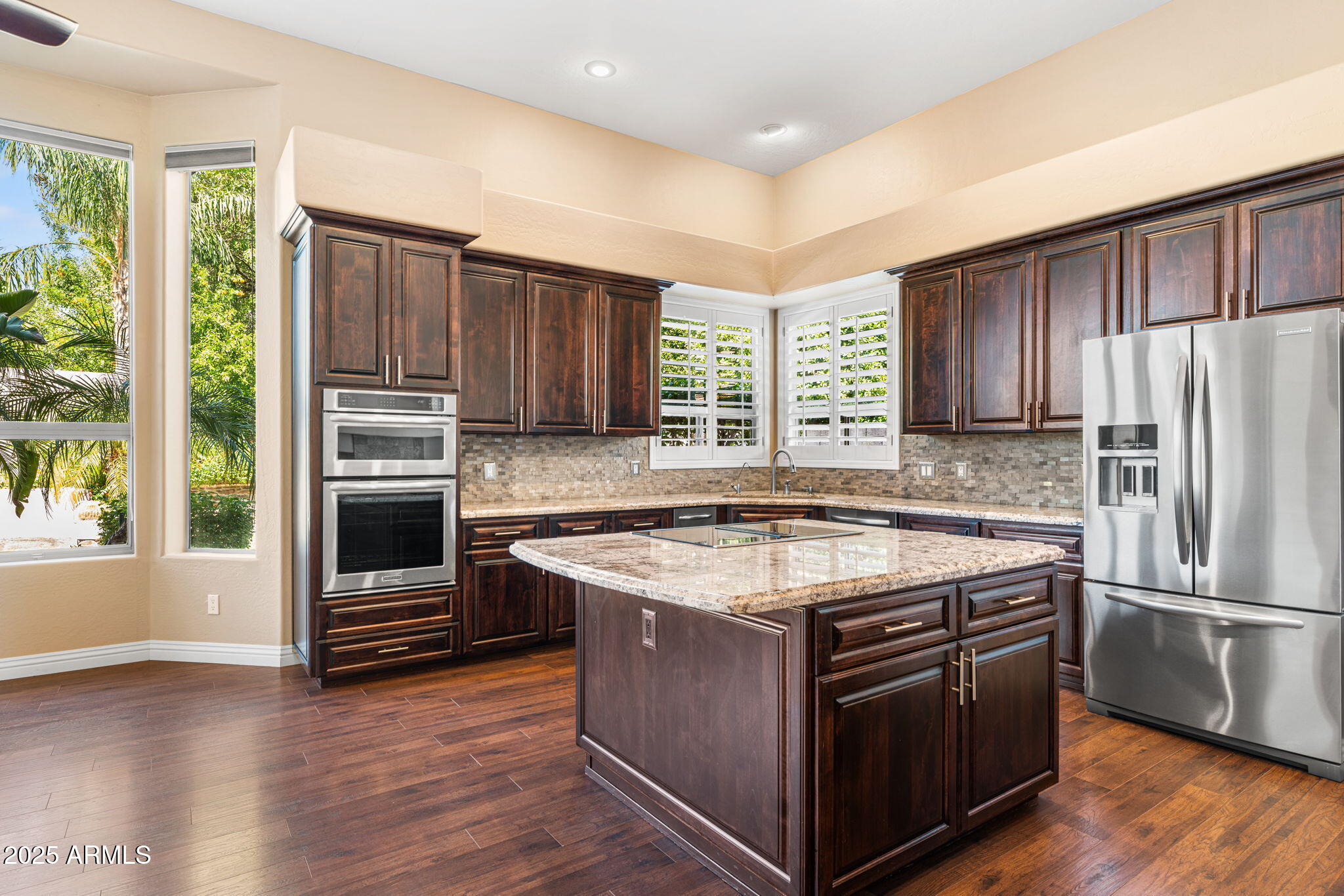 4410 East Robin Lane Phoenix, AZ 85050 - Photo 10 of 44 a kitchen with a stove and a refrigerator