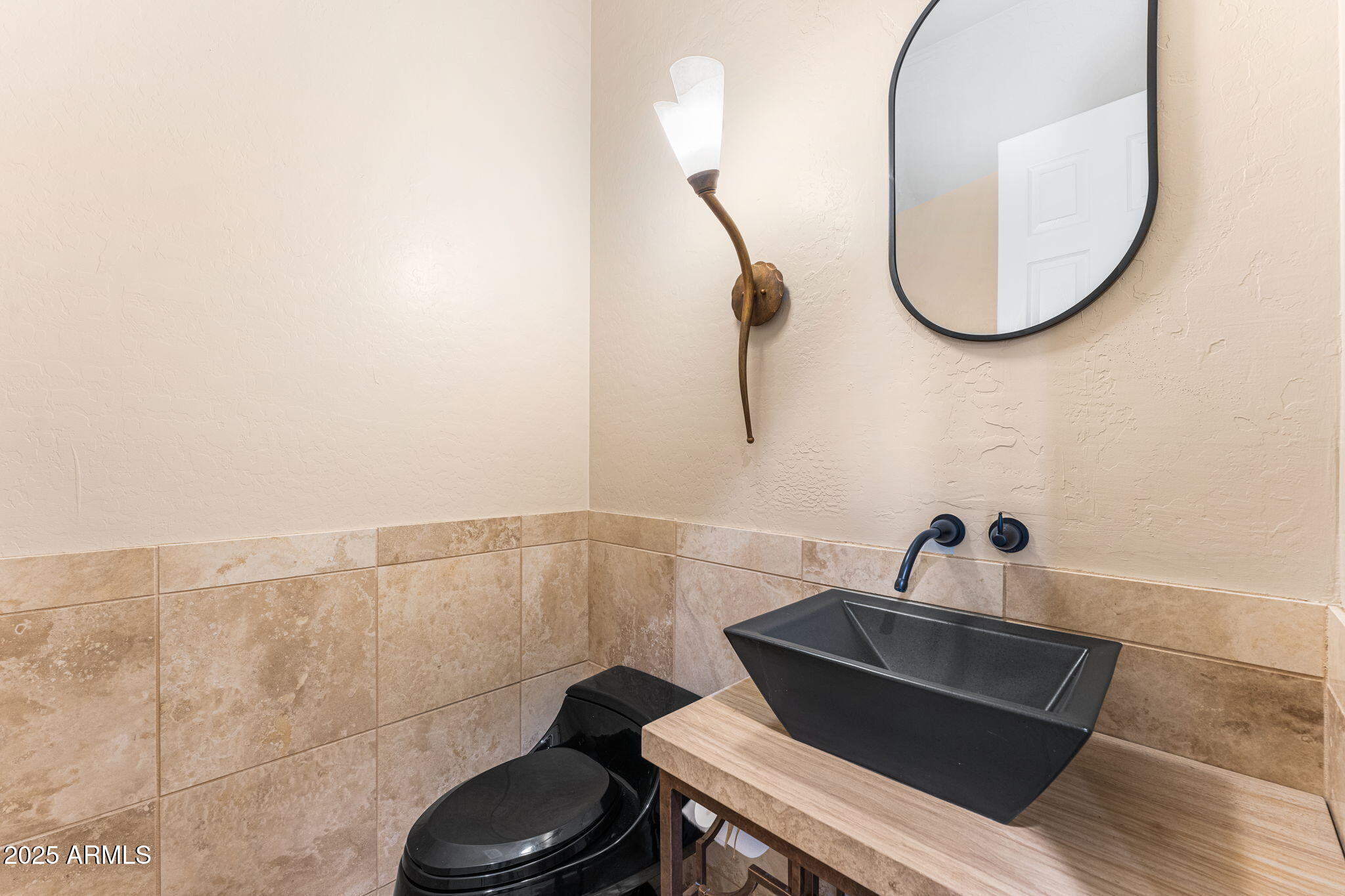 4410 East Robin Lane Phoenix, AZ 85050 - Photo 25 of 44 a bathroom with a sink and a mirror