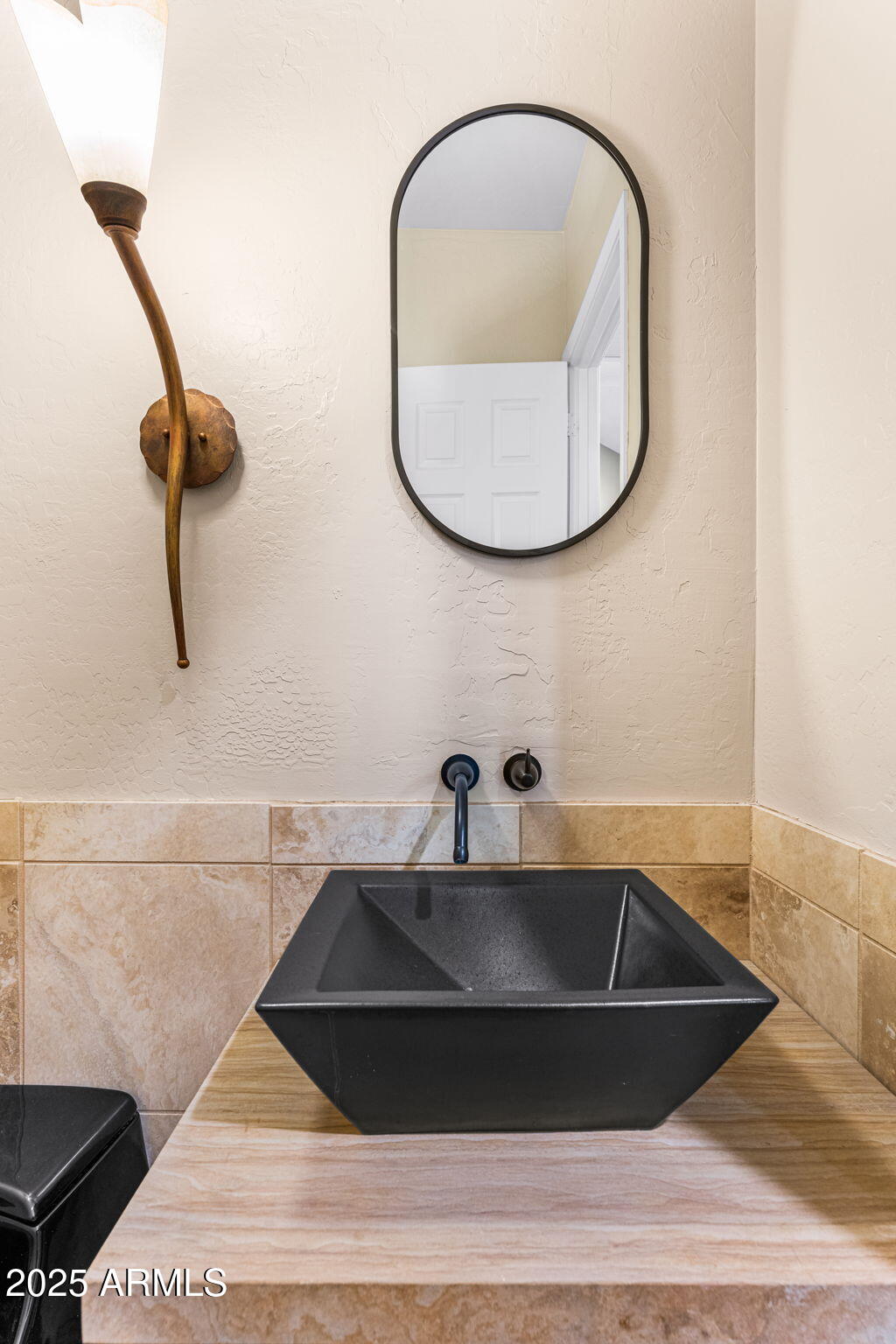 4410 East Robin Lane Phoenix, AZ 85050 - Photo 26 of 44 a bathroom with a sink and a mirror