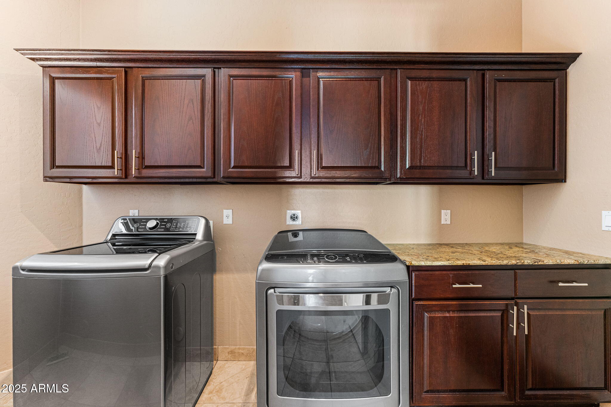 4410 East Robin Lane Phoenix, AZ 85050 - Photo 27 of 44 a kitchen with granite countertop a sink stove and cabinets