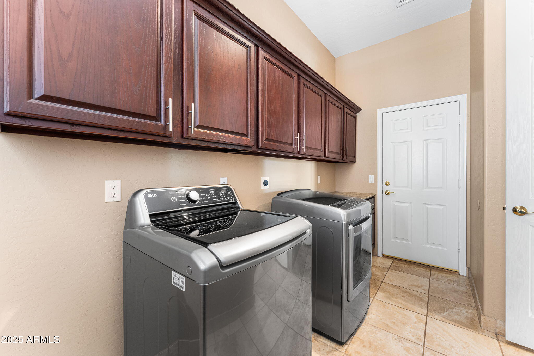 4410 East Robin Lane Phoenix, AZ 85050 - Photo 28 of 44 a kitchen with stainless steel appliances granite countertop a stove a refrigerator and cabinets
