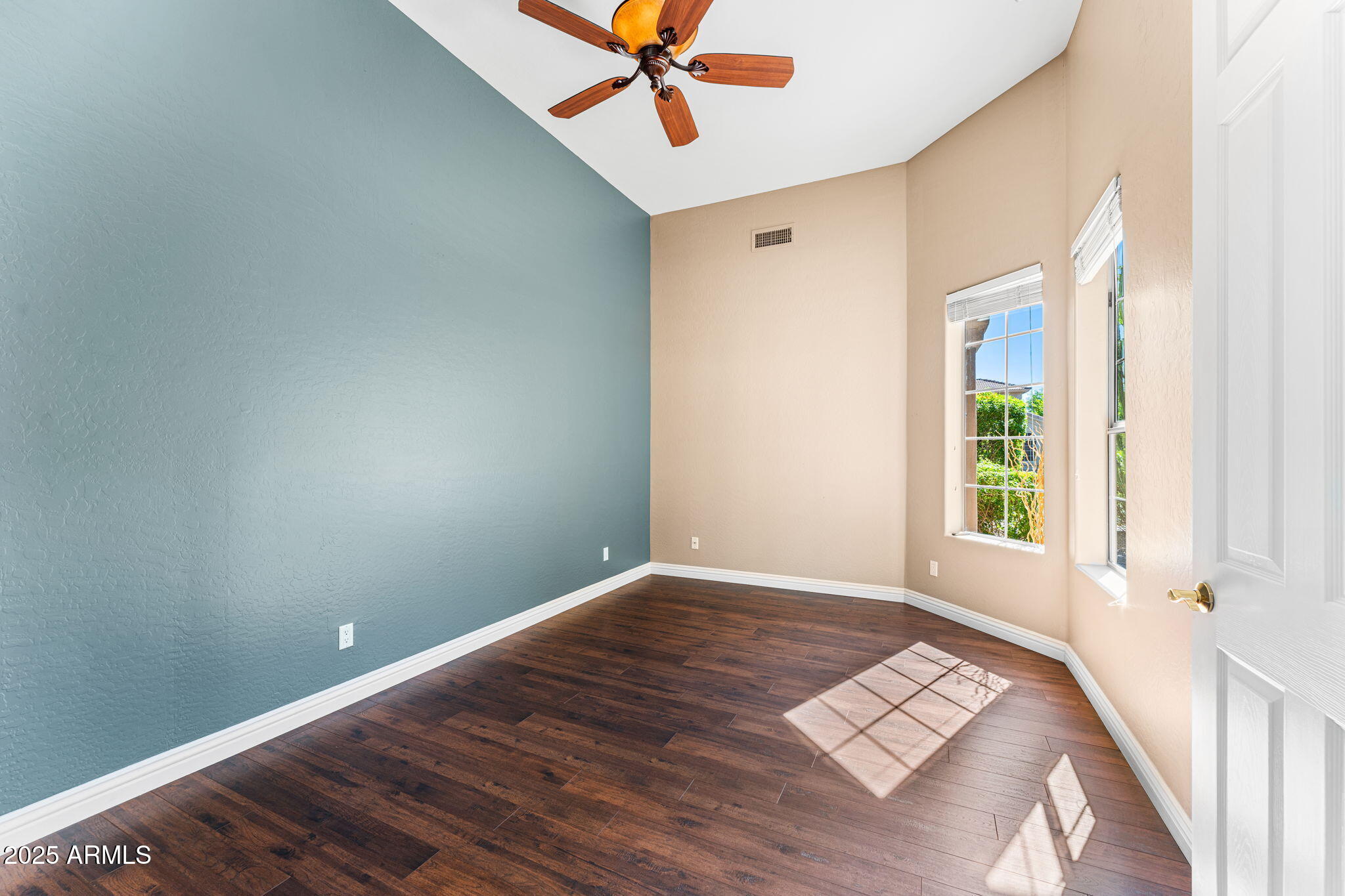 4410 East Robin Lane Phoenix, AZ 85050 - Photo 29 of 44 a view of a room with a window and a ceiling fan