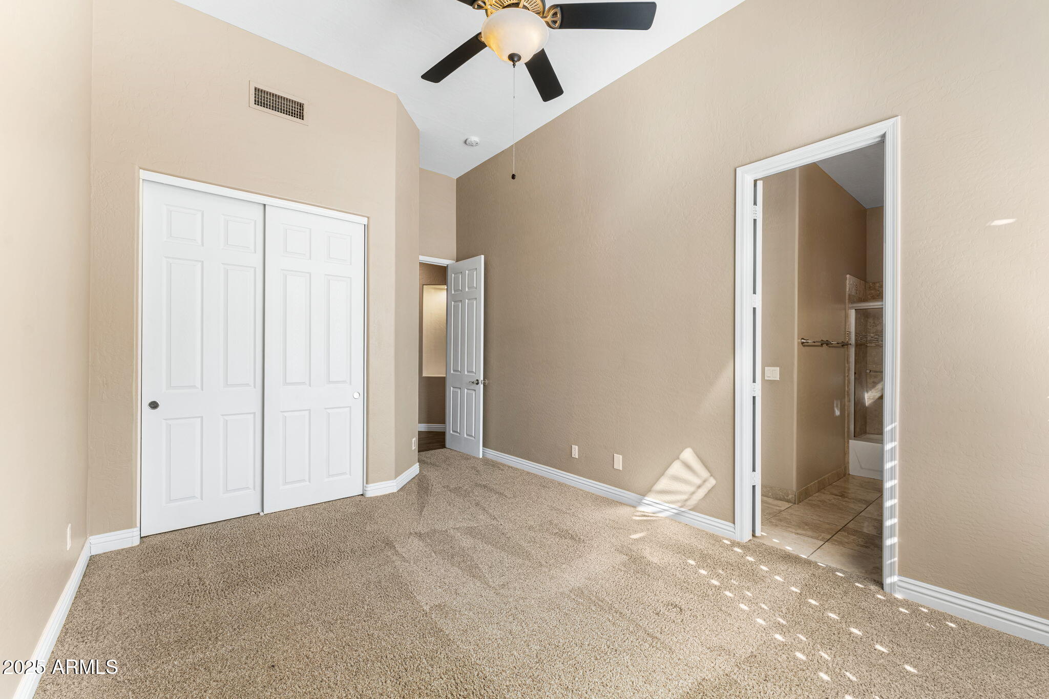 4410 East Robin Lane Phoenix, AZ 85050 - Photo 36 of 44 a view of an empty room with a ceiling fan