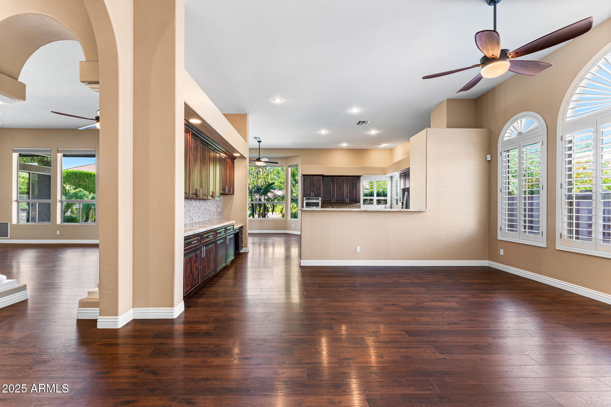 4410 East Robin Lane Phoenix, AZ 85050 - Photo 6 of 44 a view of a kitchen with a stove wooden floor and a kitchen