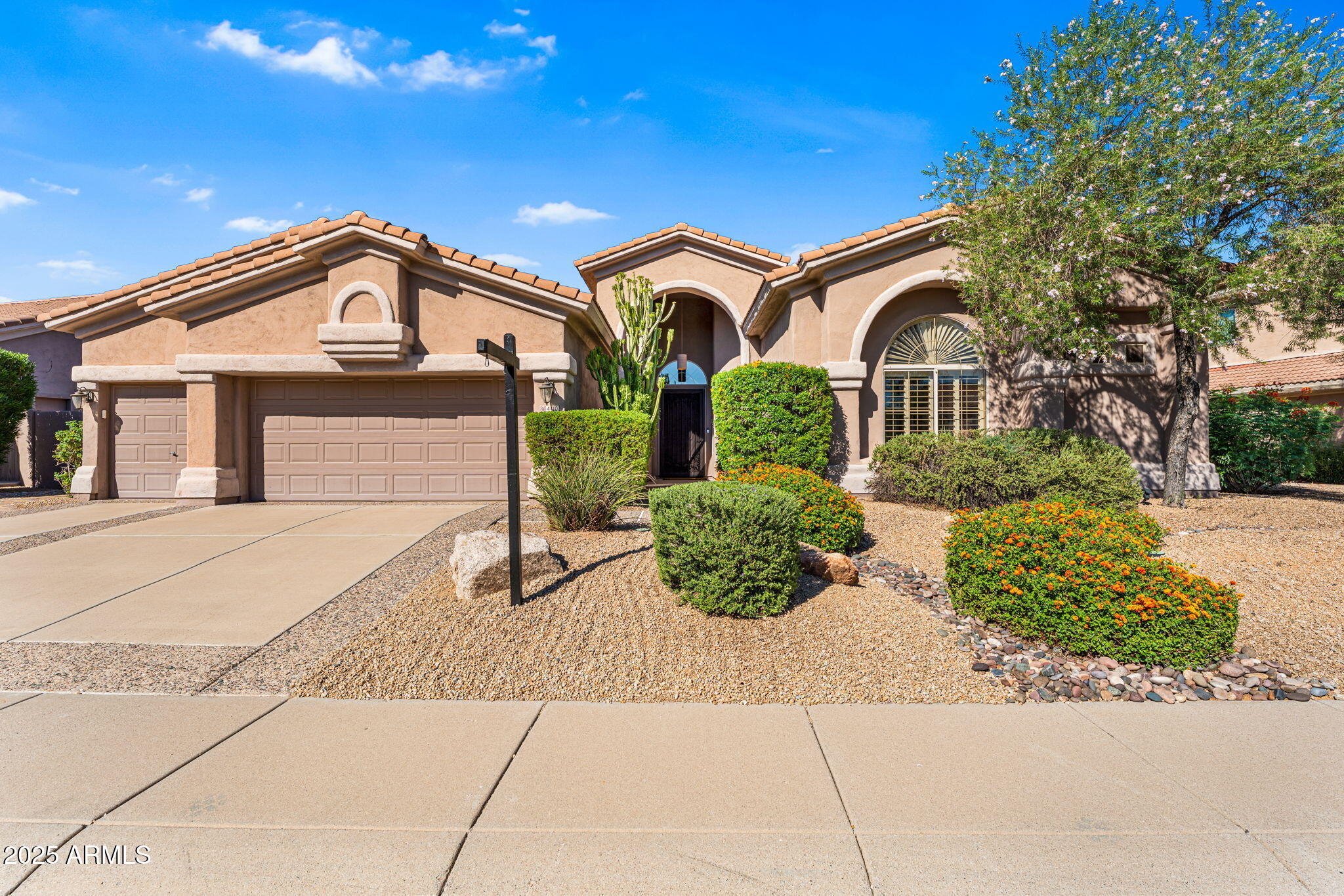 4410 East Robin Lane Phoenix, AZ 85050 - Photo 9 of 44 a front view of a house with garden