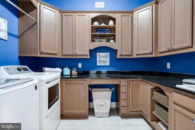 a room with lots of wooden furniture and a book shelf