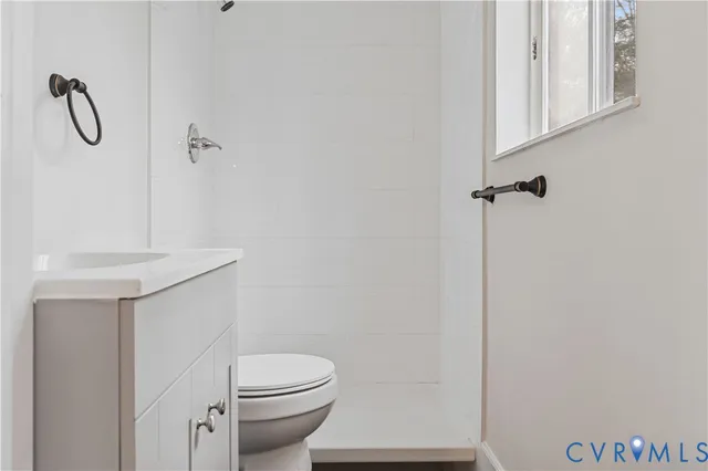 a bathroom with a toilet and a sink