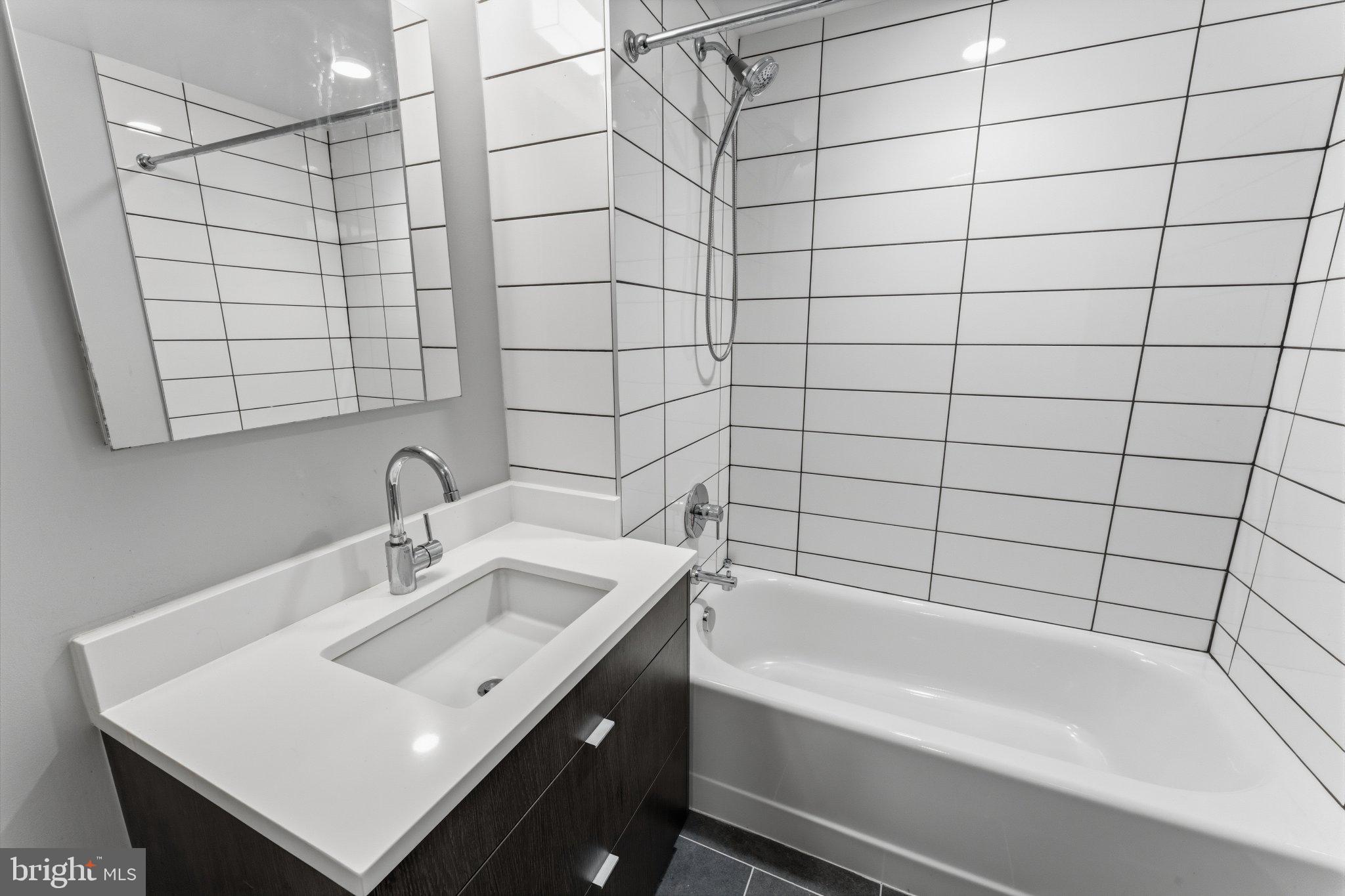 1300 4th Street Southeast, Unit 902 Washington, DC 20003 - Photo 11 of 68 Sleek modern bathroom with clean lines.