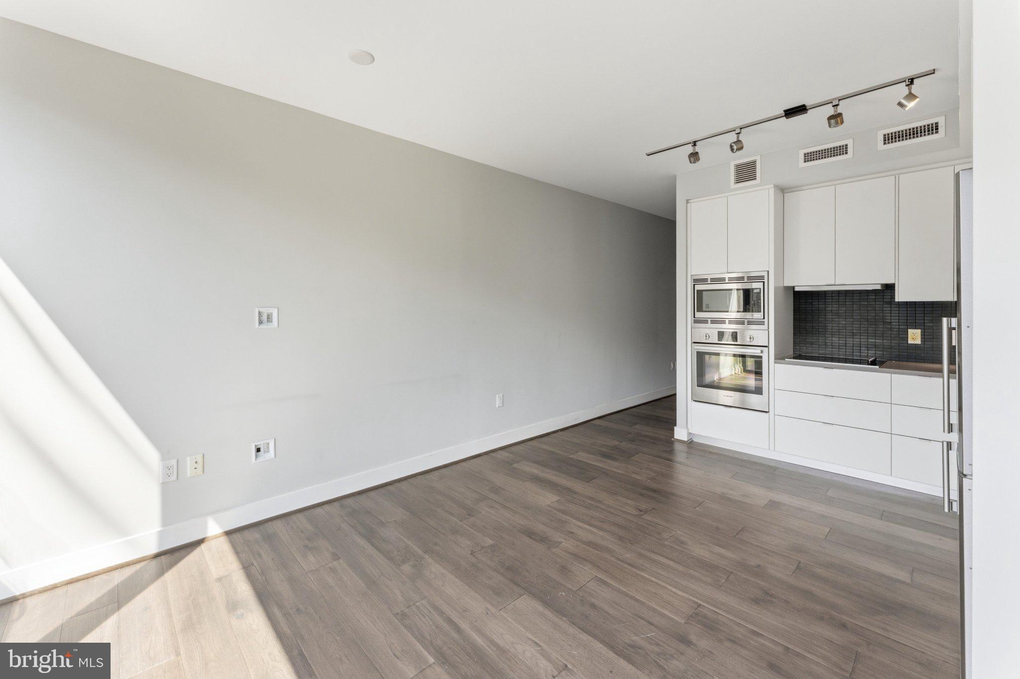 1300 4th Street Southeast, Unit 902 Washington, DC 20003 - Photo 12 of 42 a view of a kitchen with wooden floor
