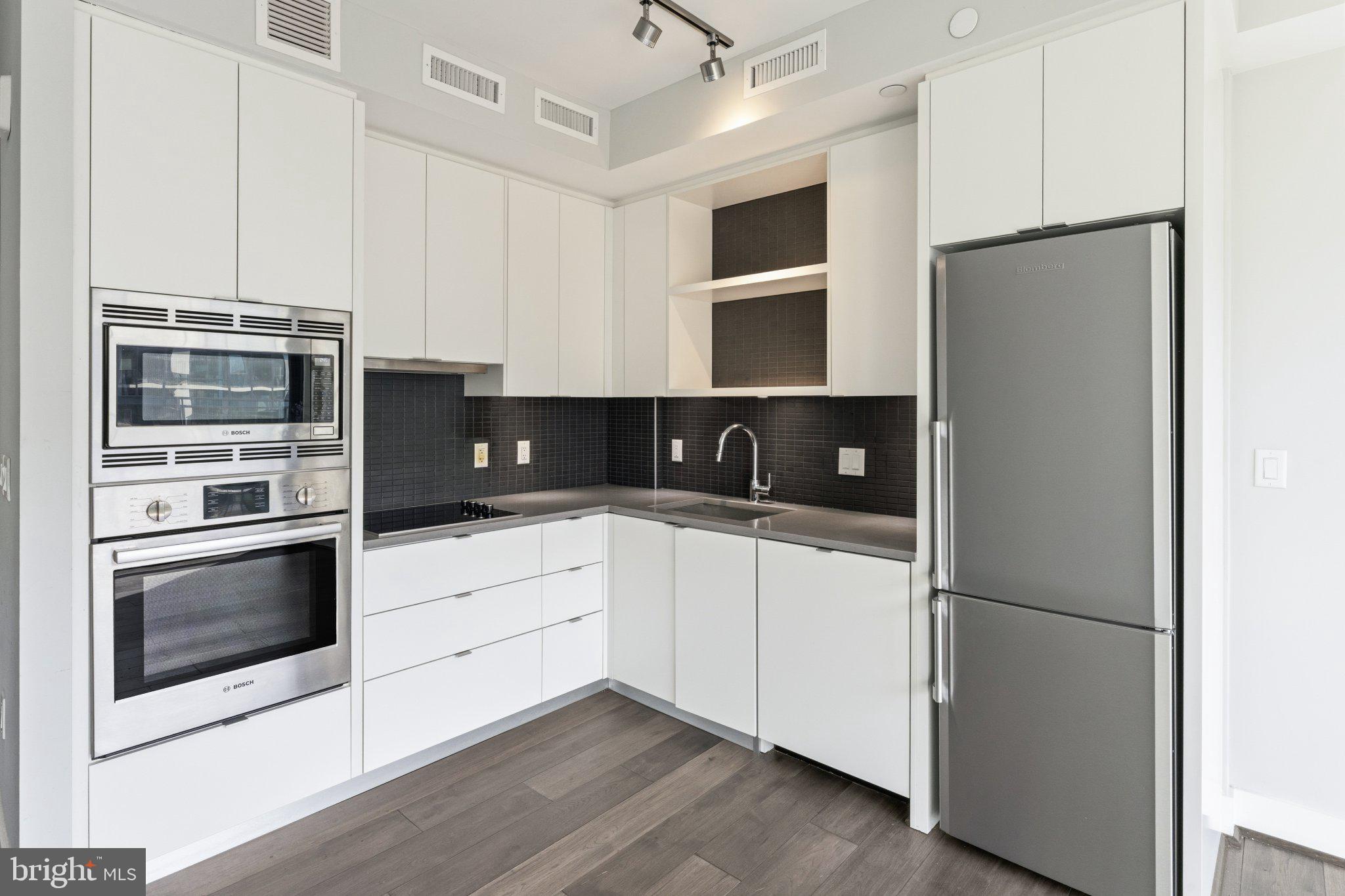 1300 4th Street Southeast, Unit 902 Washington, DC 20003 - Photo 14 of 42 Sleek modern kitchen with stylish finishes.