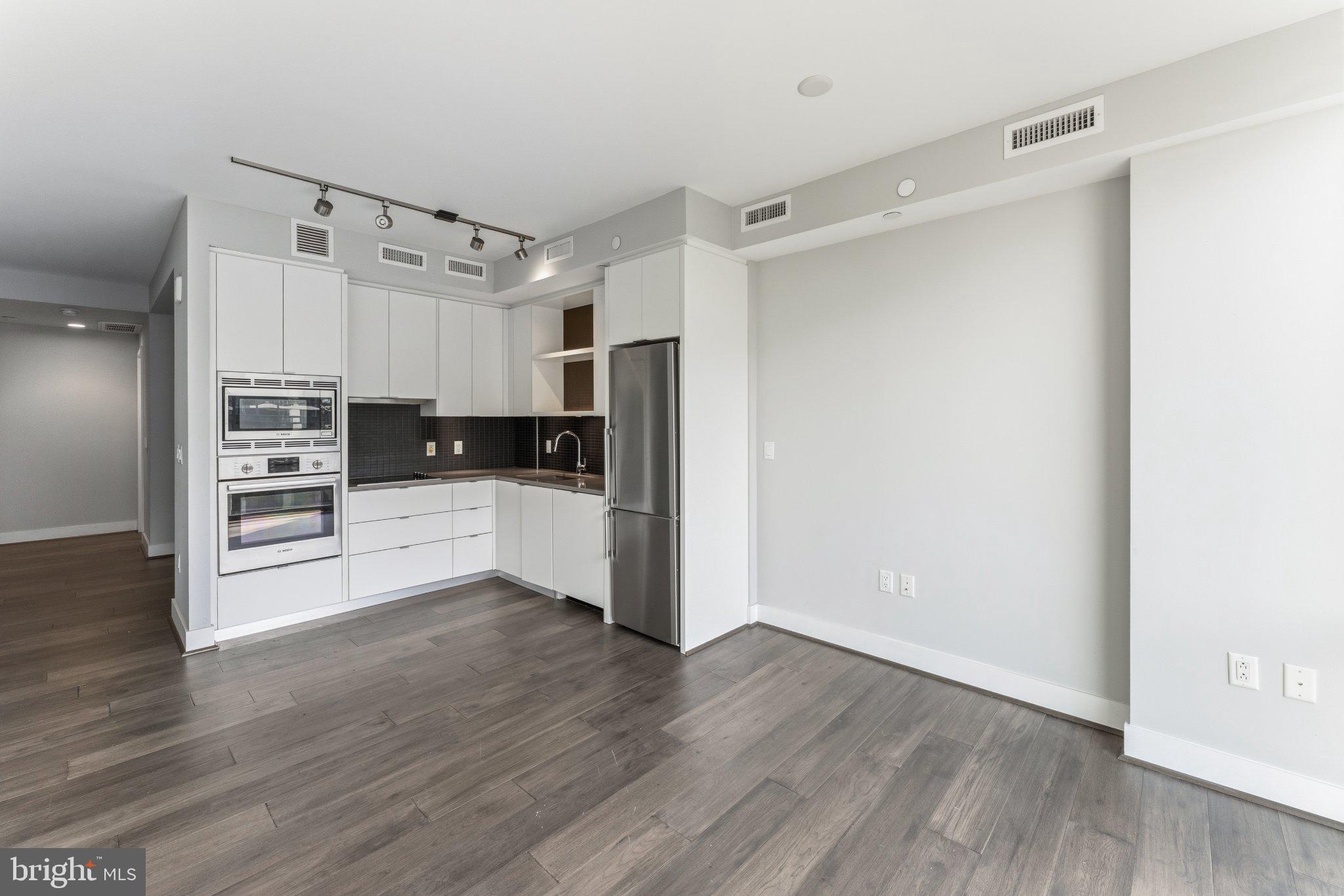 1300 4th Street Southeast, Unit 902 Washington, DC 20003 - Photo 19 of 68 Sleek modern kitchen with open layout.