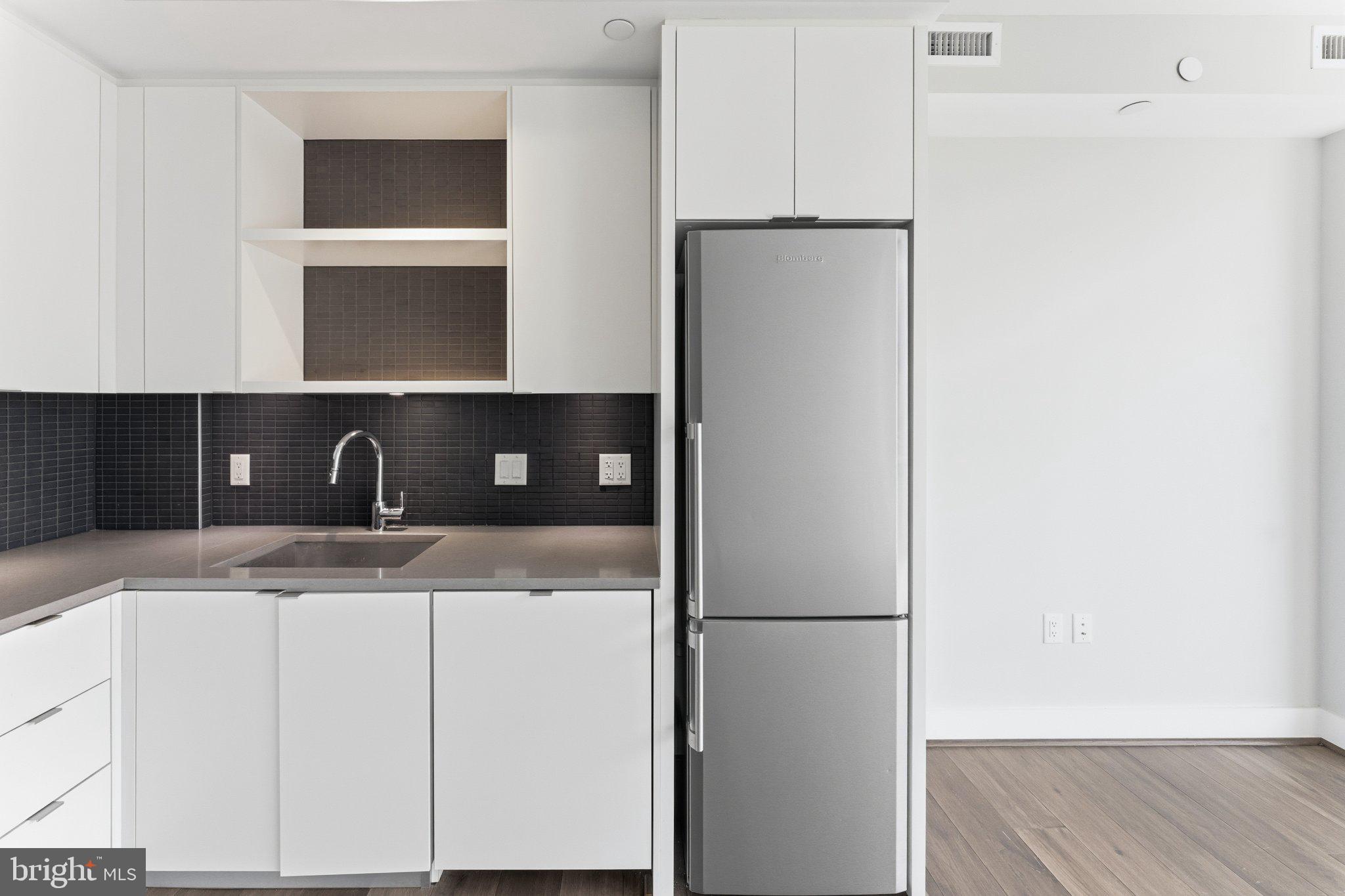 1300 4th Street Southeast, Unit 902 Washington, DC 20003 - Photo 22 of 68 Sleek modern kitchen with stylish finishes.