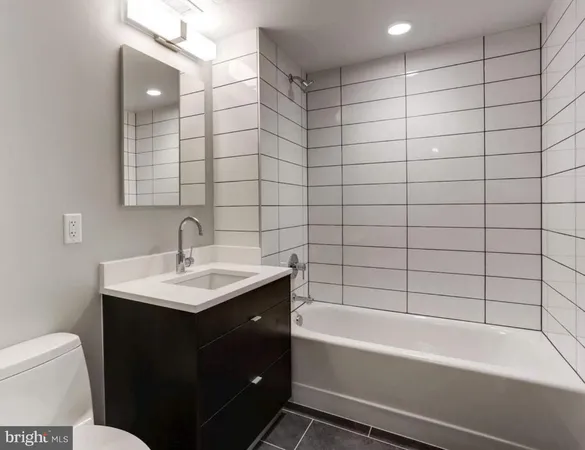 a bathroom with a sink toilet a bathtub and a shower