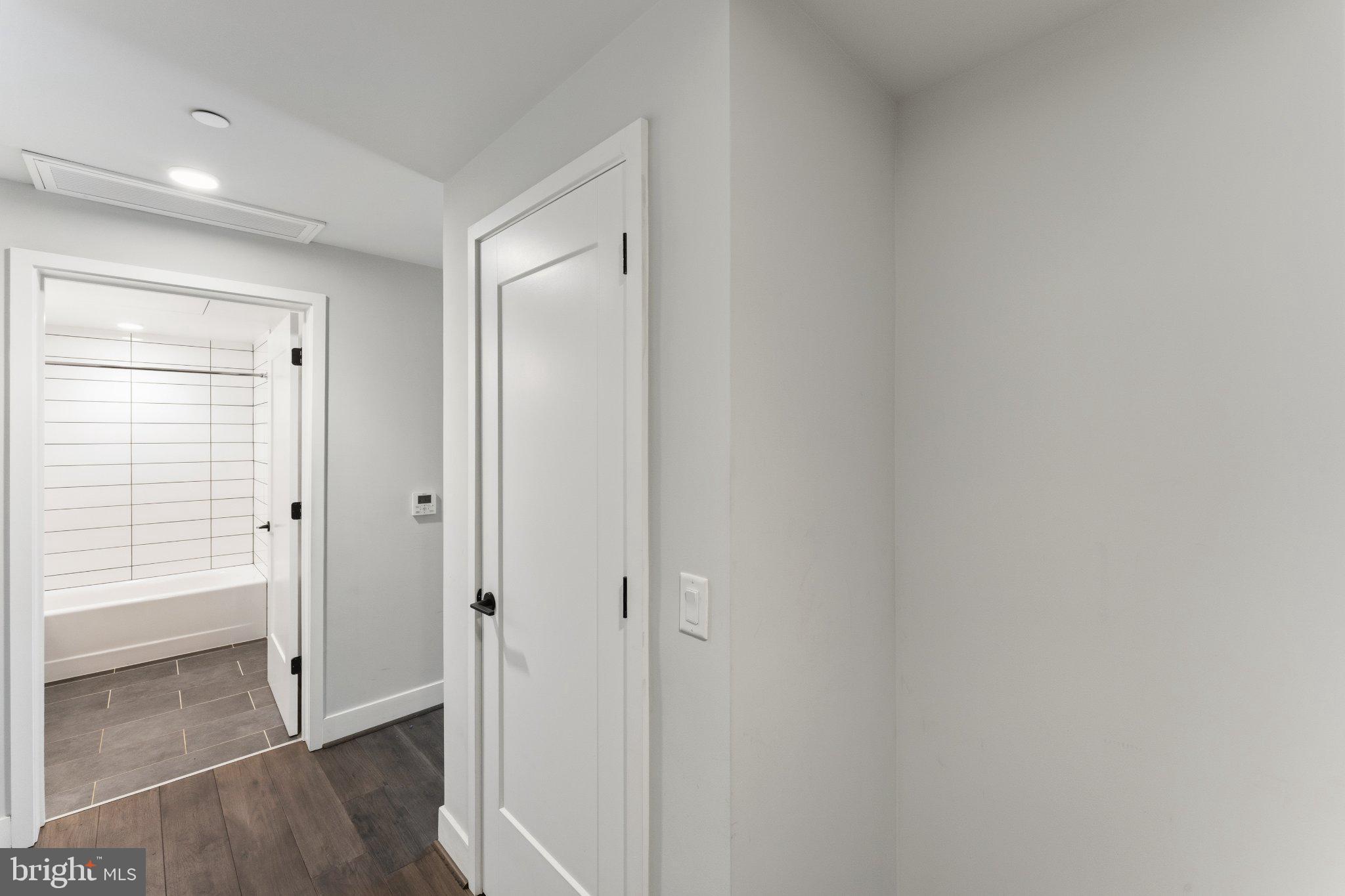 1300 4th Street Southeast, Unit 902 Washington, DC 20003 - Photo 5 of 42 a view of a hallway with wooden floor