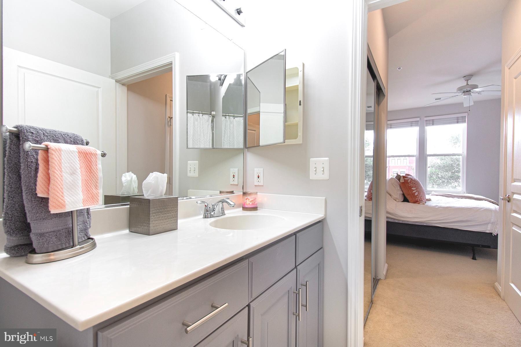 12001 Market Street, Unit 127 Reston, VA 20190 - Photo 11 of 27 Bathroom has dual entry way from hall or bedroom