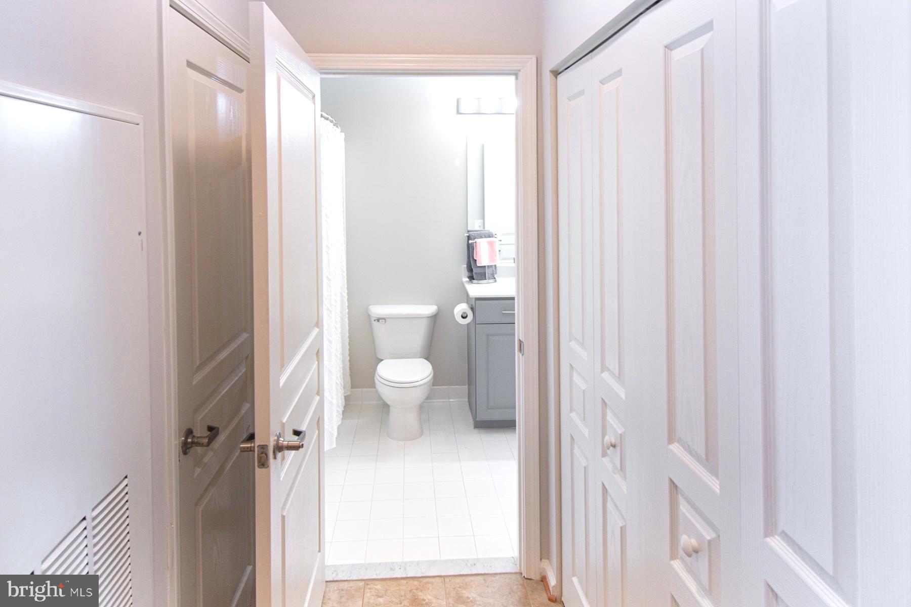 12001 Market Street, Unit 127 Reston, VA 20190 - Photo 14 of 27 Entrance to bathroom from hallway