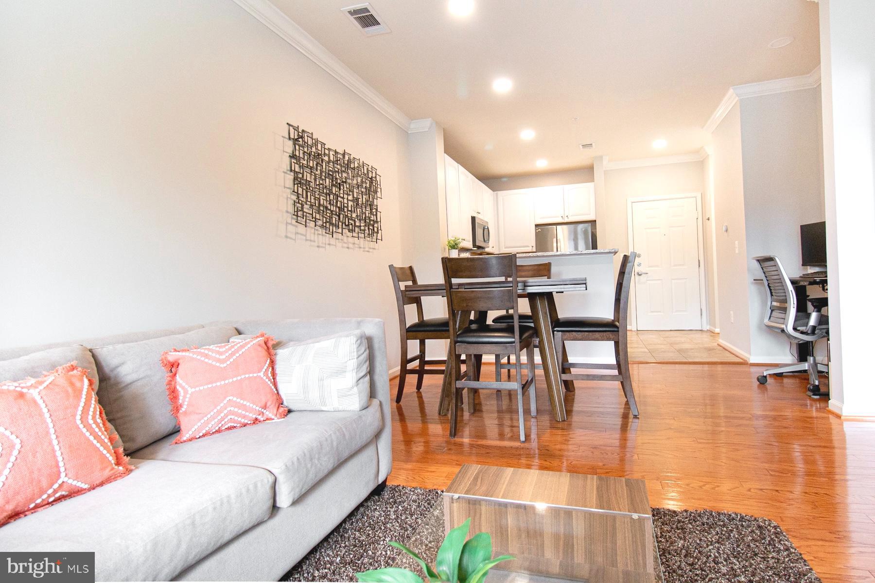 12001 Market Street, Unit 127 Reston, VA 20190 - Photo 4 of 27 Living Dining with recessed lighting