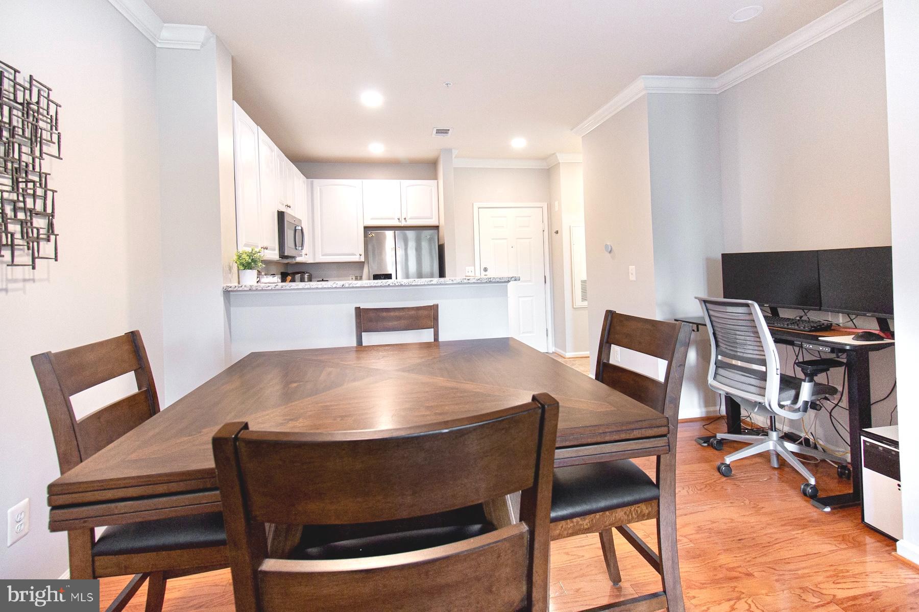 12001 Market Street, Unit 127 Reston, VA 20190 - Photo 5 of 27 Dining area with computer/desk nook