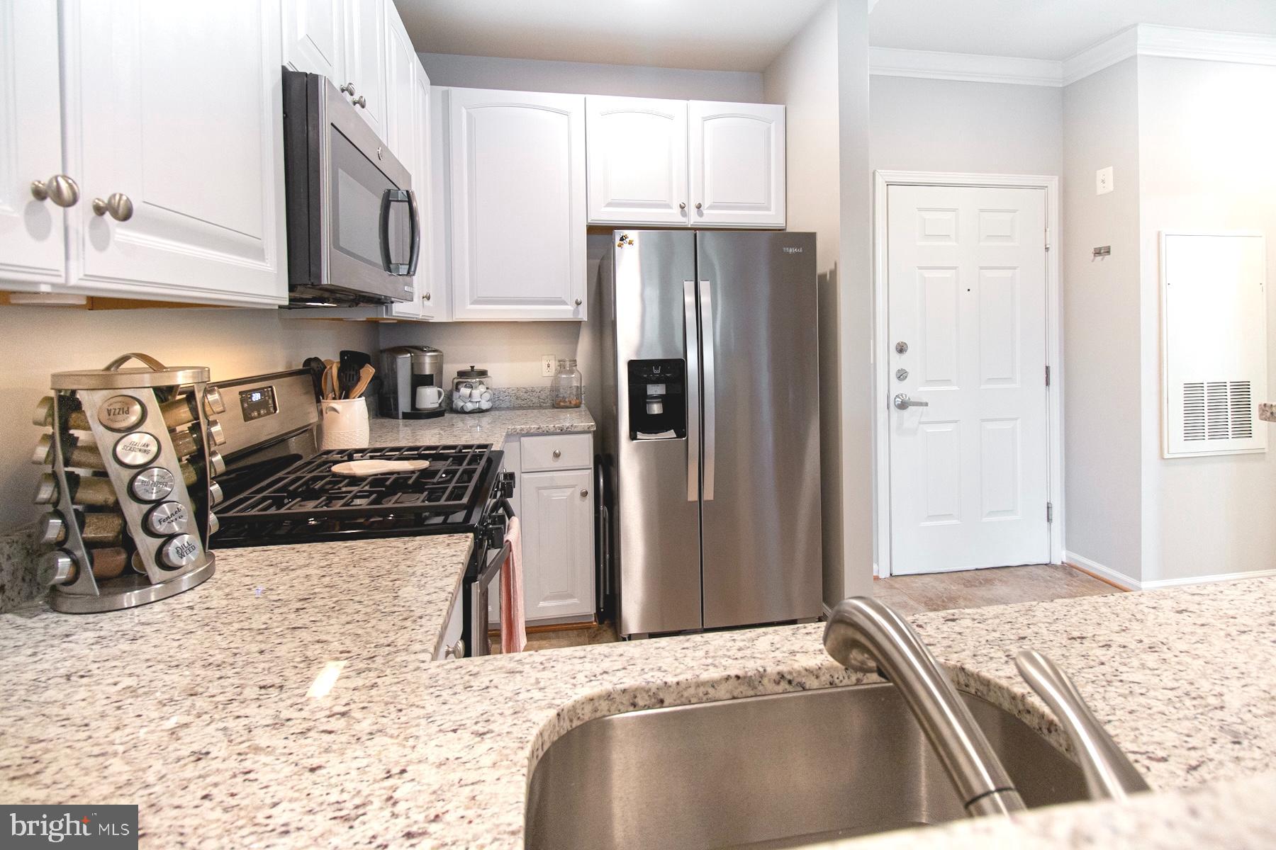 12001 Market Street, Unit 127 Reston, VA 20190 - Photo 7 of 27 Beautiful white cabinets/ under cabinet lighting