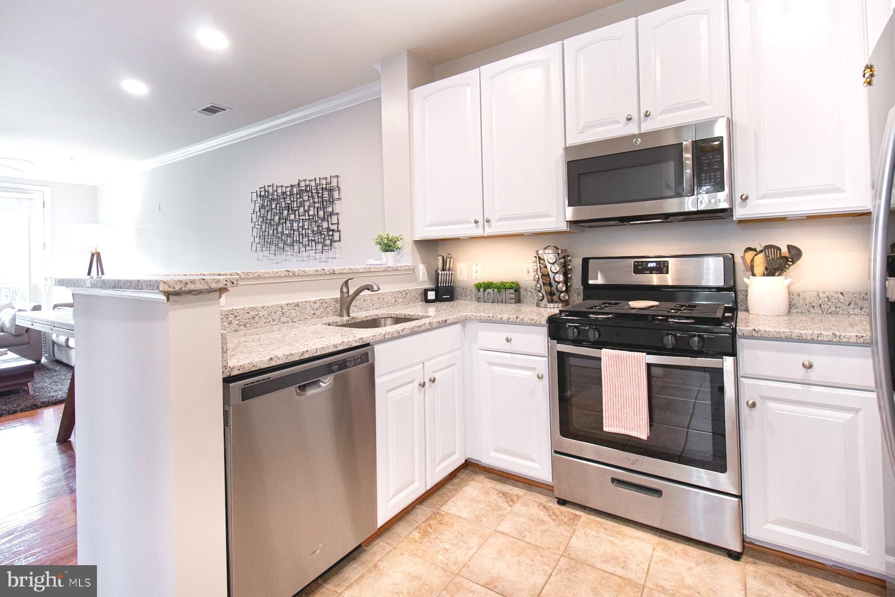 12001 Market Street, Unit 127 Reston, VA 20190 - Photo 8 of 27 Kitchen has recessed lighting