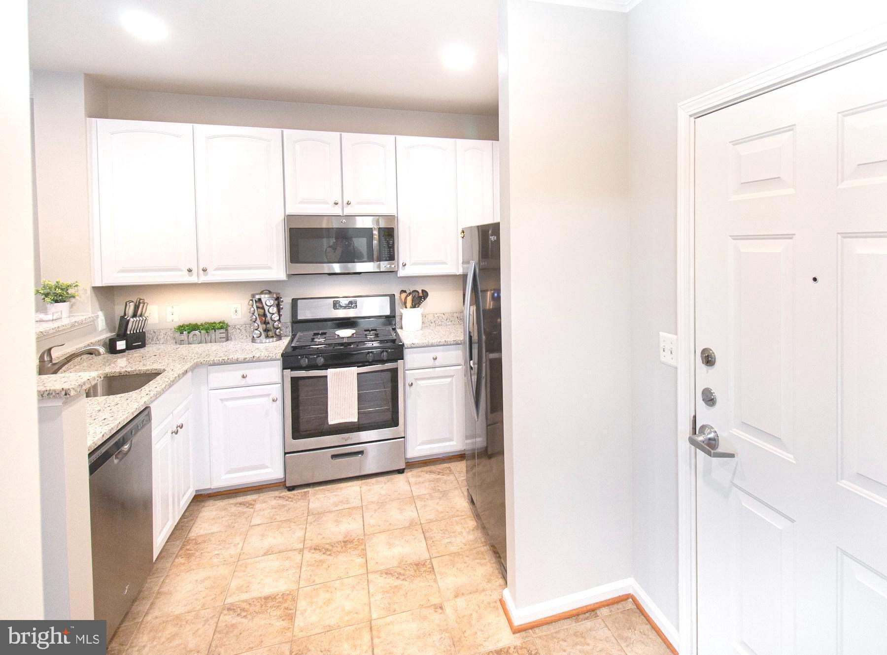 12001 Market Street, Unit 127 Reston, VA 20190 - Photo 9 of 27 Recessed lighting in Kitchen