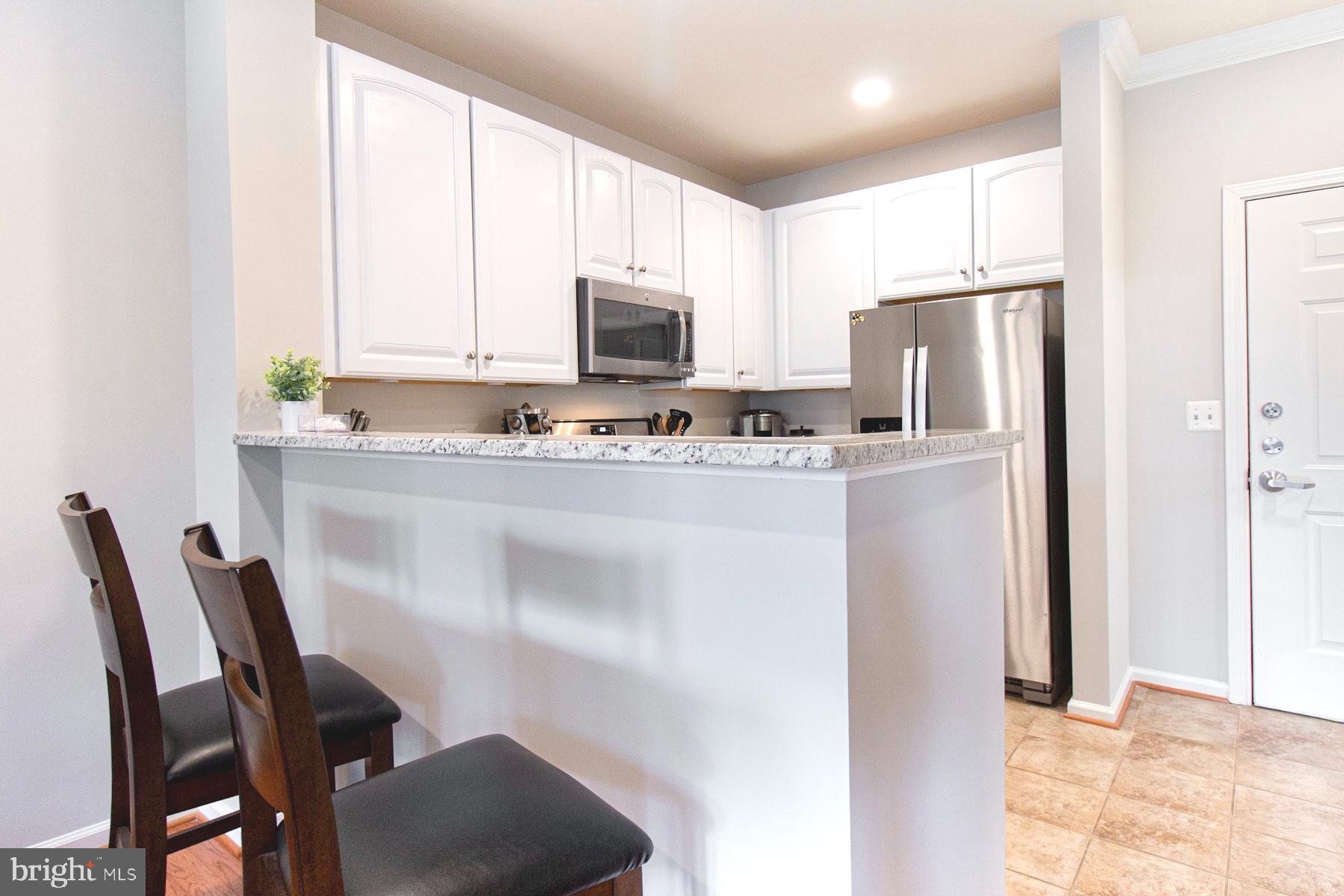 12001 Market Street, Unit 127 Reston, VA 20190 - Photo 10 of 27 Bar area for extra seating