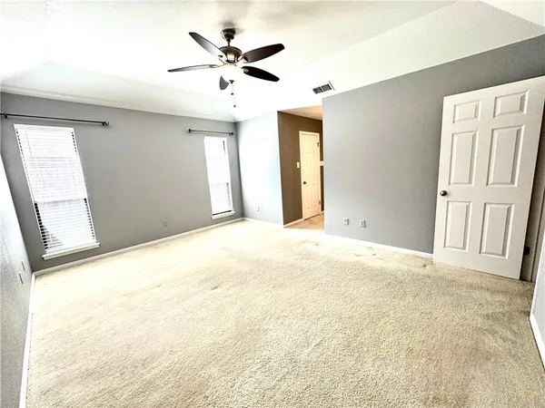 a view of an empty room with a window