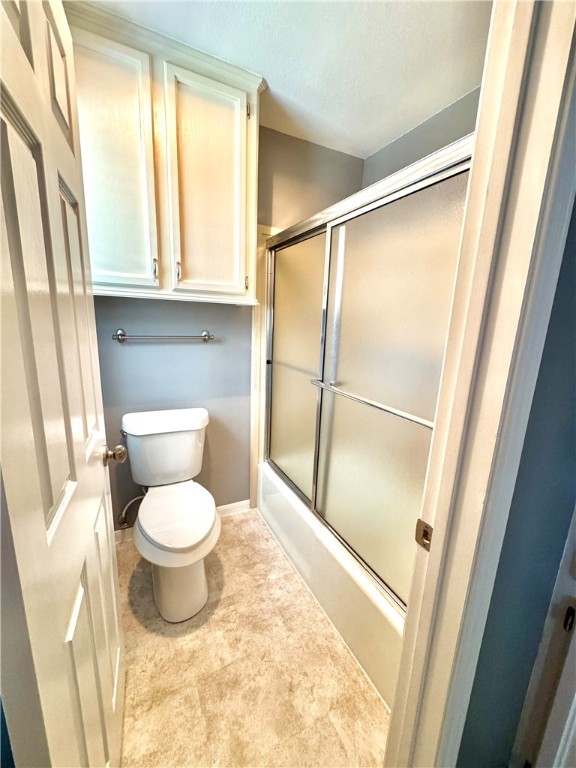 6929 Monarch Street Corpus Christi, TX 78413 - Photo 9 of 16 a bathroom with a toilet and a shower