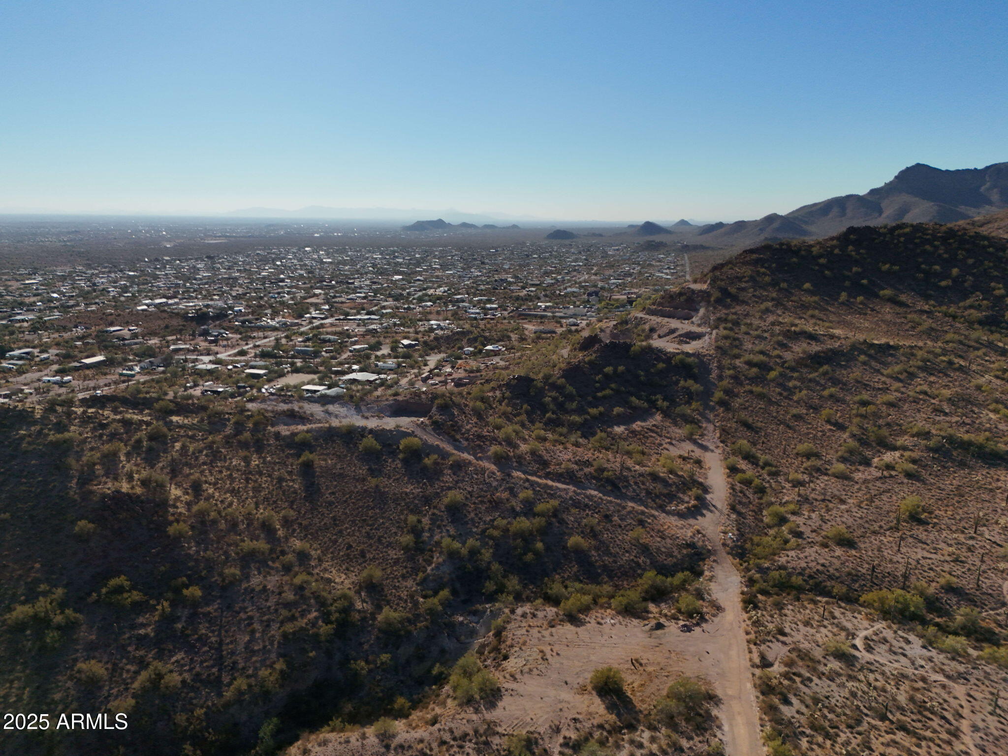 493 West McDowell Boulevard Apache Junction, AZ 85120 - Photo 17 of 29 an aerial view of house with yard and mountain view in back