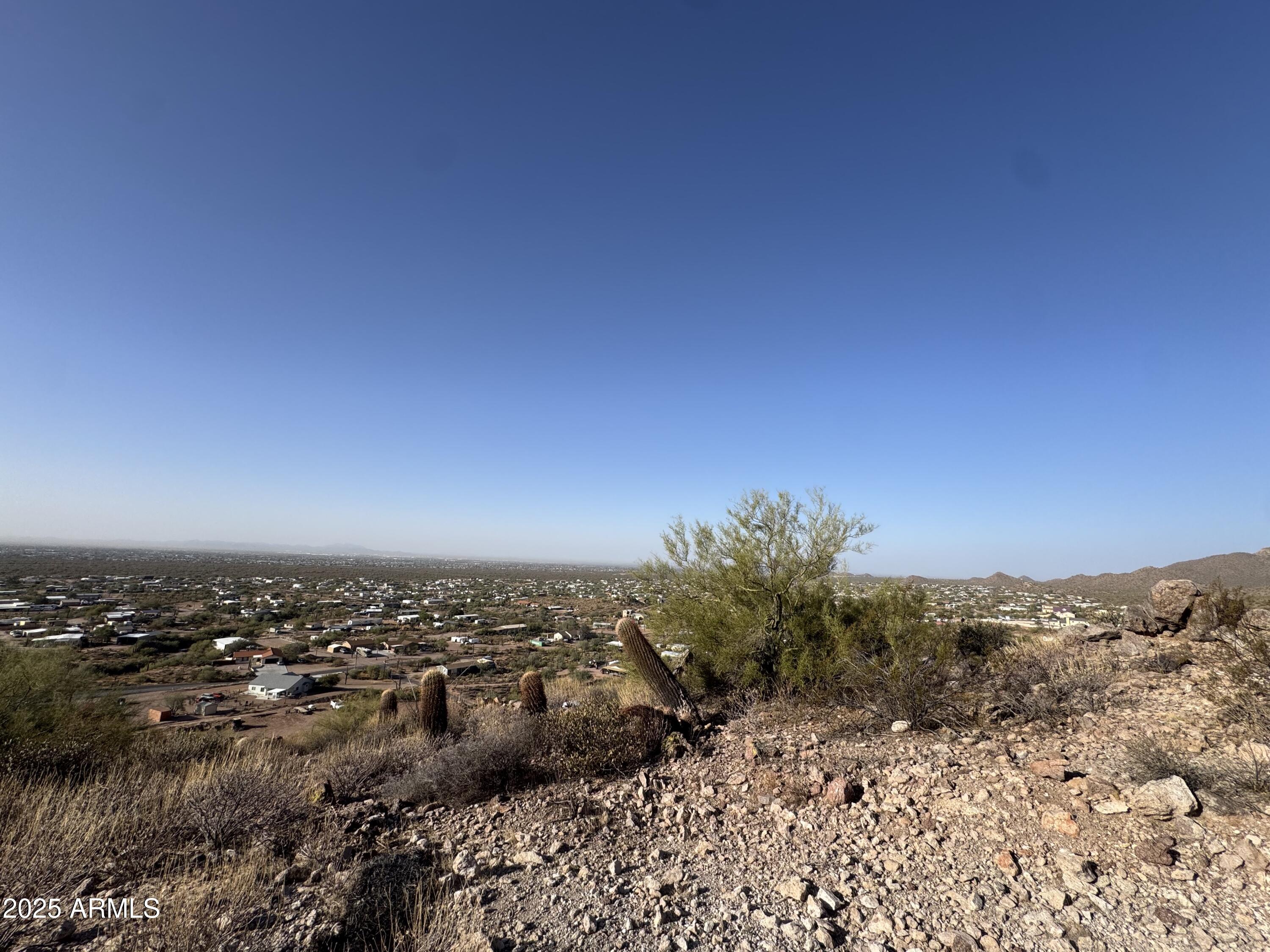 493 West McDowell Boulevard Apache Junction, AZ 85120 - Photo 3 of 29 a view of a large building with a mountain in the background