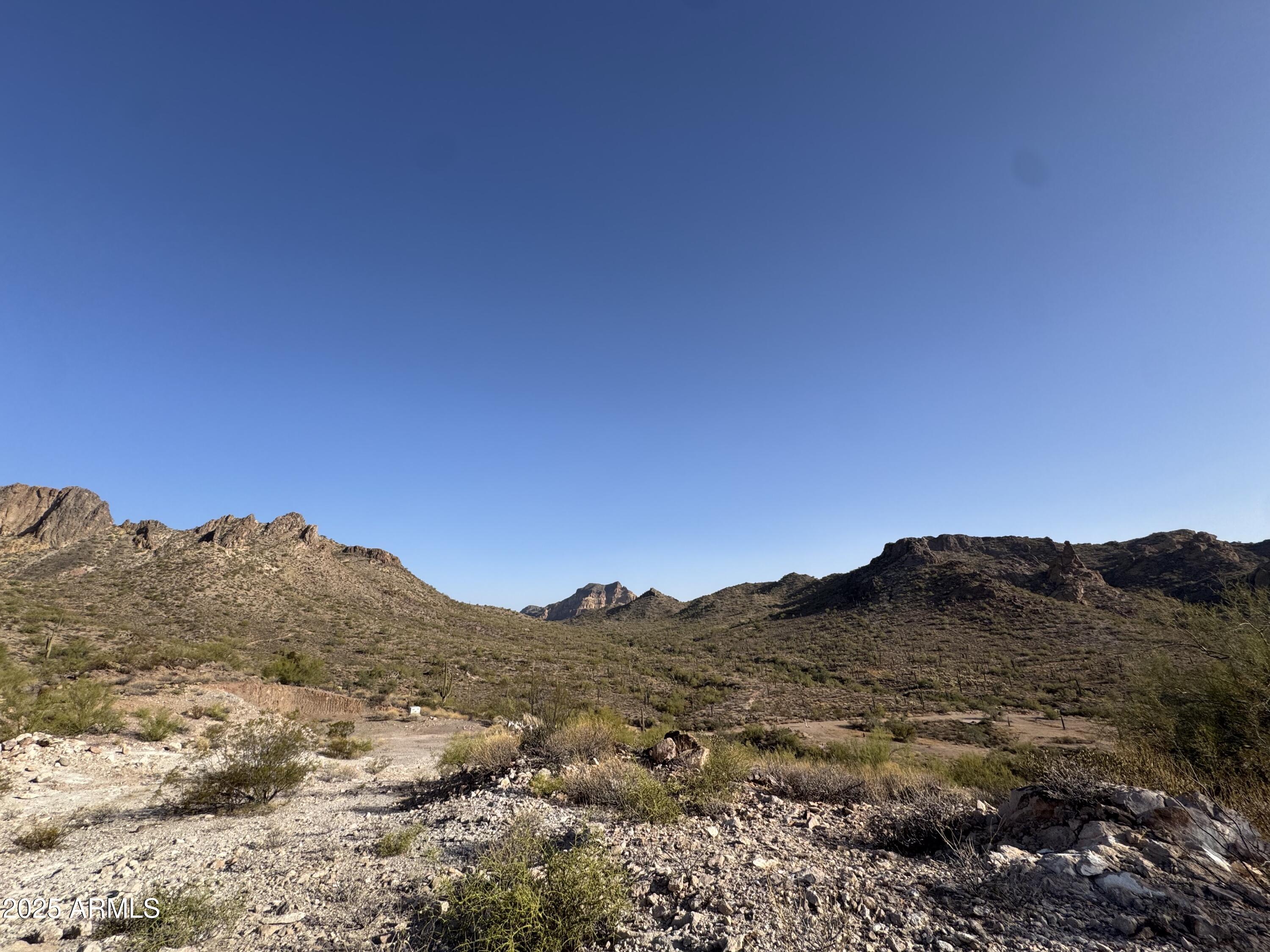 493 West McDowell Boulevard Apache Junction, AZ 85120 - Photo 7 of 29 a view of a mountain range in a cloudy sky