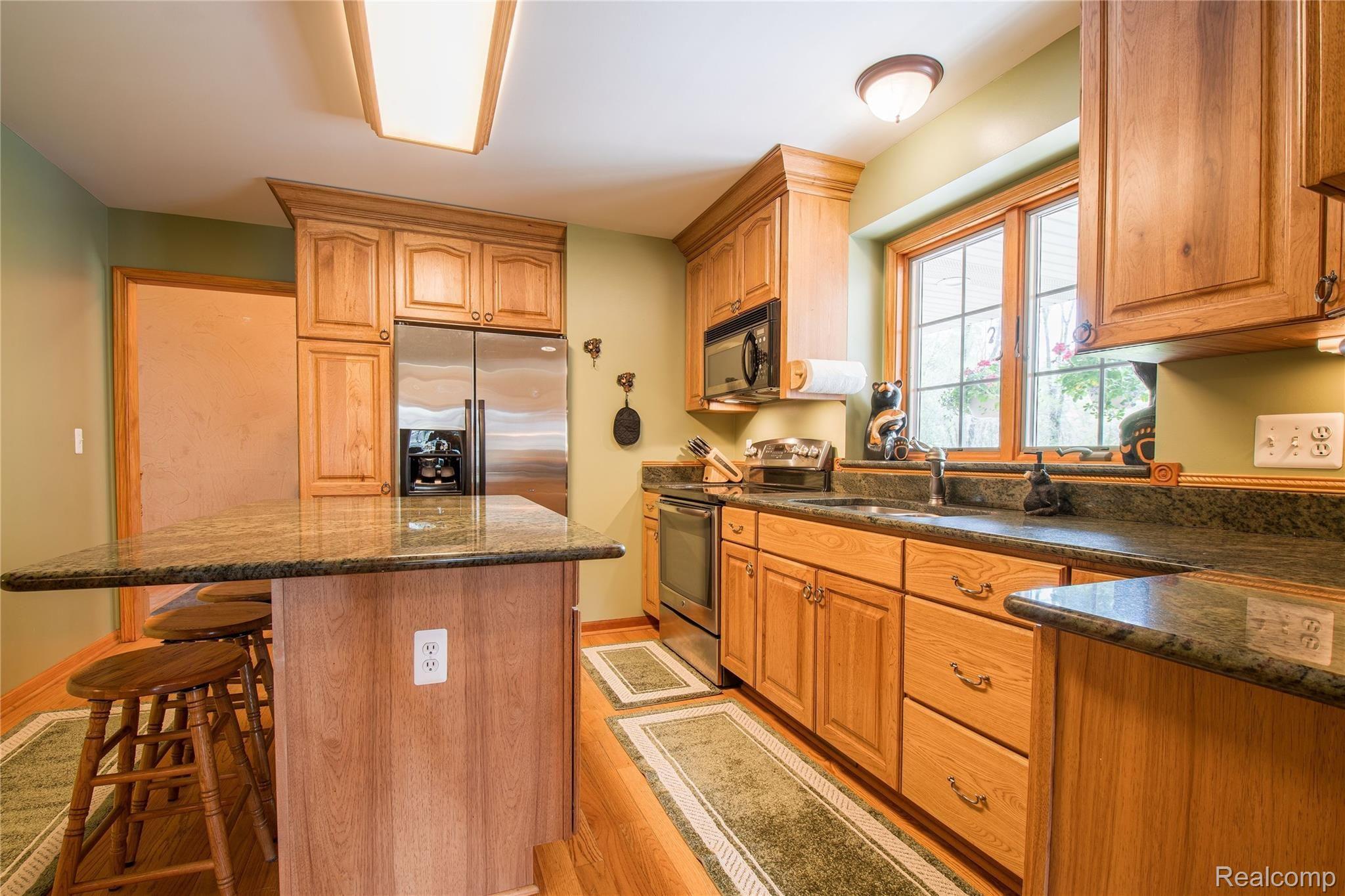 5150 Chase Lake Road Fowlerville, MI 48836 - Photo 12 of 34 Kitchen with Stainless Steel Appliances