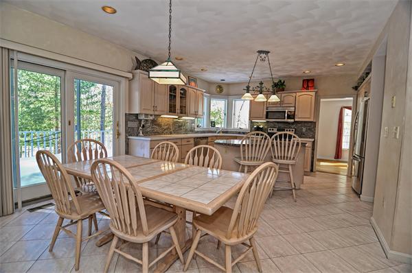 21 Lt J Cabral Drive Middleton, MA 01949 - Photo 11 of 30 a dining room with furniture a chandelier and wooden floor