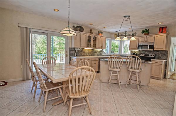 21 Lt J Cabral Drive Middleton, MA 01949 - Photo 13 of 30 a dining room with furniture a chandelier and wooden floor