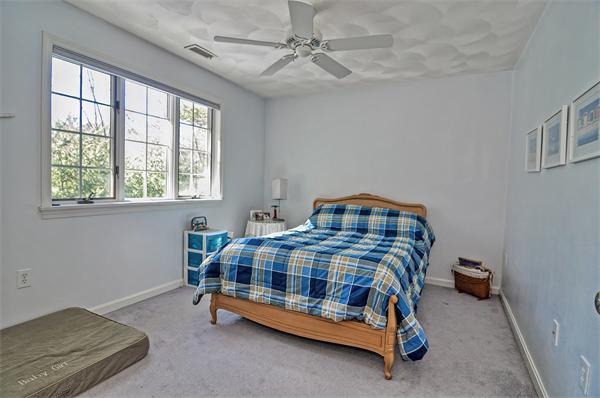21 Lt J Cabral Drive Middleton, MA 01949 - Photo 18 of 30 a bedroom with a bed and a window