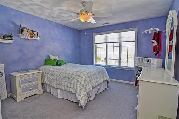 21 Lt J Cabral Drive Middleton, MA 01949 - Photo 19 of 30 a bedroom with a bed and a window